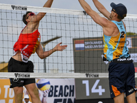 David Schweiner (L) of Czech Republic action during the men's Volleyball World Beach Pro Tour Finals against  Alexander Brouwer and Robert M...