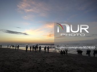Palestinians people at Gaza Beach enjoy during the sunset, on February 3, 2023. (