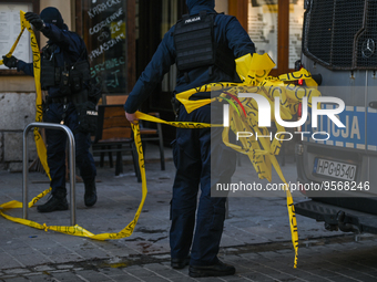 KRAKOW, POLAND - February 09: 
Members of the local Police secure the spot of a deadly shooting at a popular tourist bar in Krakow's Old Tow...