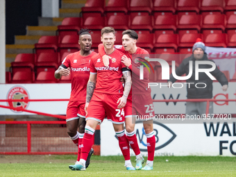 Walsall's Joe Low (24) and teammates celebrate scoring their side's first goal of the game during the Sky Bet League 2 match between Walsall...