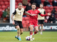George Moncur of Leyton (L) and Walsall's Robbie Willmott during the Sky Bet League 2 match between Walsall and Leyton Orient at the Banks's...