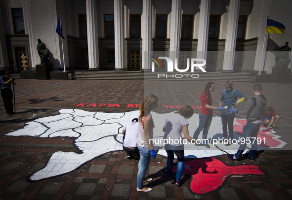 Pro-Ukrainian activists draw a giant map of Ukraine with marked territory which can be lost in result of separatist's activity, during their...