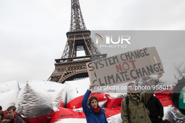 Climate demonstrators hold up a sign with the text 
