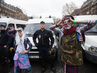 Clowns are searching for the saviours of the climate in front of policemen during the D12 demonstrations during the last day of COP21 on Ave...