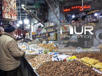 A man sells nuts on a stall on traditional Arab souk in Amman, capital of Jordan on January 12, 2023. (