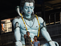 People click selfie picture with a Hindu idol Lord Shiva on the day of Maha Shivaratri in Mumbai, India, 18 February, 2023. Maha Shivaratri...