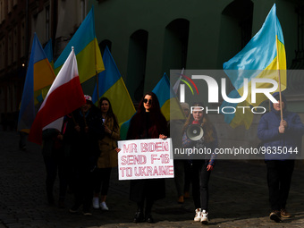 Ukrainian citizens and supporters attend a daily demonstration of solidarity with Ukraine one day ahead of one-year anniversary of Russian i...