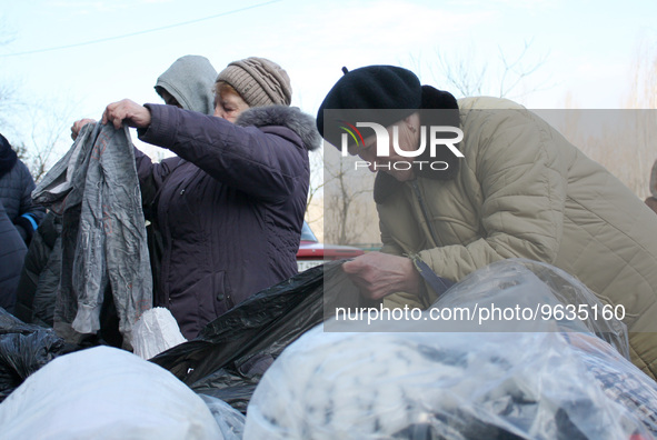 KHERSON, UKRAINE - FEBRUARY 21, 2023 - Residents of the Korabelnyi district of Kherson receive humanitarian aid from the members of the Volu...