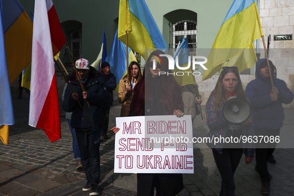 Ukrainian citizens and supporters attend a daily demonstration of solidarity with Ukraine one day ahead of one-year anniversary of Russian i...