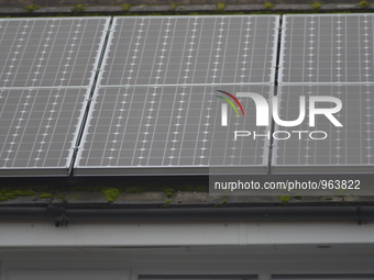 Light shining on solar panels, a form of domestic renewable energy supply, in Stockport, England, on Wednesday 16th December 2015. The panel...
