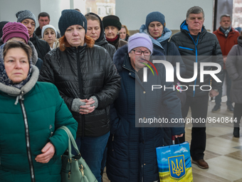Residents of Bucha and relatives of people killed during the war in Ukraine take part in the prayer service ''For peace in Ukraine and its d...