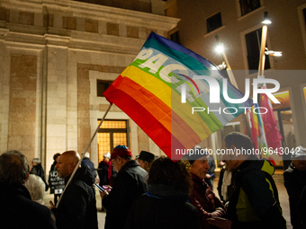 Demonstrators and a peace rainbow flag  are seen in L'Aquila, Italy, on febraury 24, 2023, during the first anniversary of russian invasion...