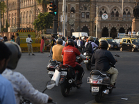 A Zomato food app delivery boy rides a scooter in a traffic in Mumbai, India, 01 March, 2023.  (