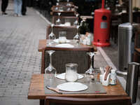 Empty tables of a restaurant  in Athens, Greece on March 1, 2023. (
