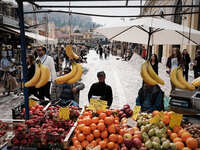 A man is selling fruits at Monastiraki square in Athens, Greece on March 1, 2023. (