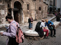 People enjoy their time at Ermou street near Monastiraki square in Athens, Greece on March 1, 2023. (