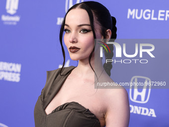 Dove Cameron wearing a Jacquemus dress, Giuseppe Zanotti shoes, and Tyler Ellis clutch arrives at the 2023 Billboard Women In Music held at...
