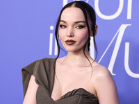 Dove Cameron wearing a Jacquemus dress, Giuseppe Zanotti shoes, and Tyler Ellis clutch arrives at the 2023 Billboard Women In Music held at...