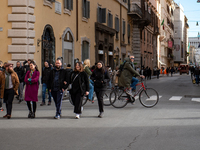 People walk in Via del Corso, in Rome Italy on March 2, 2023 (