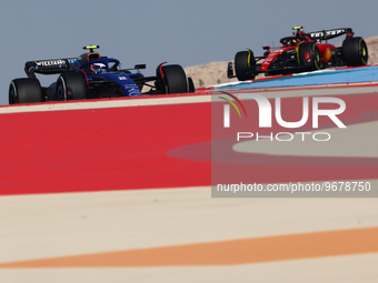 Logan Sargeant of Williams and Carlos Sainz of Ferrari during the first practice ahead of the Formula 1 Bahrain Grand Prix at Bahrain Intern...