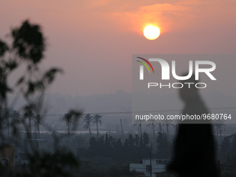 

A general view of the sunset in Juhr al-Deek, southeast of Gaza City, Palestine, on March 3, 2023 is seen. (
