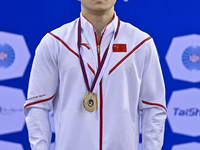 Gold medalist Yang Liu of China poses during the awarding ceremony after the mens Rings final at the 15th FIG Artistic Gymnastics World Cup...