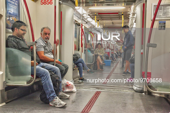 Commuters ride in a TTC subway car in Toronto, Ontario, Canada. 