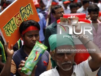 An ice-cream seller into may day rally.
Garment workers & other labor organization in Bangladesh shout slogans during the May day celebratio...