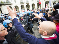 Protest of the extreme left against the Italian Democratic Party at labour day, on May 1, 2014, in Turin, Italy. (
