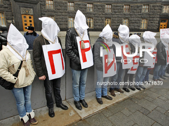 
Ukrainian activists who are suffering from HIV AIDS and hepatitis stand with bags on their heads and the noose around his neck as a symbol...