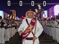 Qatari marching band performing during perform global street art performances as part of the three-day Darb Lusail Parade at The Lusail Boul...