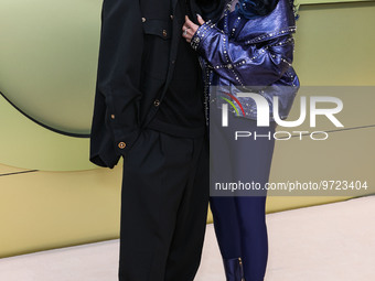 Alexander Edwards and Cher arrive at the Versace Fall/Winter 2023 Fashion Show held at the Pacific Design Center on March 9, 2023 in West Ho...