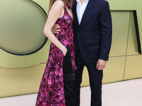 Allison Williams and Alexander Dreymon arrive at the Versace Fall/Winter 2023 Fashion Show held at the Pacific Design Center on March 9, 202...