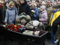 Ukrainians attend a farewell ceremony for Ukrainian soldier Hero of Ukraine Dmytro Kotsiubailo, 27, who died in a battle for Bakhmut, on the...