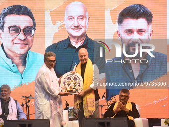 

BJP Senior Leader Swapan Dasgupta is handing over an idol of Hindu goddess Durga to Actor Anupam Kher as the Ministry of Culture of the Go...