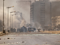 Clashes between police officers using teargas, and protesters throwing rocks, set barricades in fire, in Dakar on March 16, 2023. Security f...