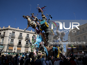  This photograph shows a 'falla' (a huge ornate cardboard sculpture made to eventually be burnt) during the Fallas festival in Valencia.  Th...
