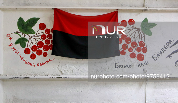CHYHYRYN, UKRAINE - MARCH 15, 2023 - A black-red flag is seen on the wall in the bomb shelter set up by the students and teachers of Chyhyry...