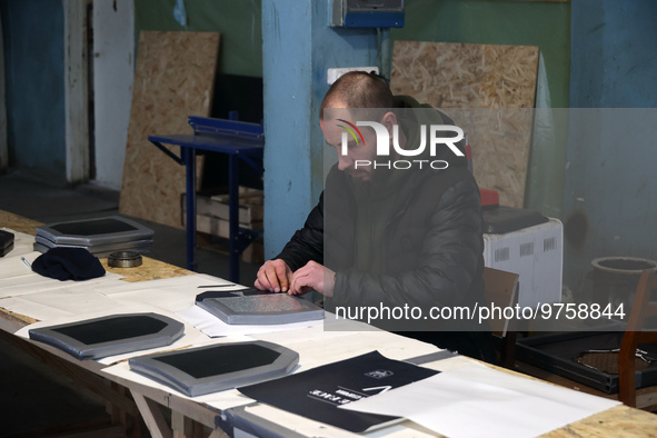 KHARKIV, UKRAINE - MARCH 16, 2023 - A worker manufactures a ballistic plate at the Ukrainian Spring Center, Kharkiv, northeastern Ukraine. N...