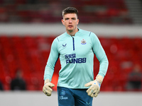Nick Pope of Newcastle United warms up ahead of kick-off during the Premier League match between Nottingham Forest and Newcastle United at t...
