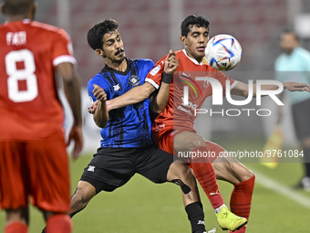 Abdulla Essa Al-Sulaiti (R) of Al Arabi SC and Fares Khled Azadi (L) of Al Sailiya SC battle for the ball during the QNB Stars League match...