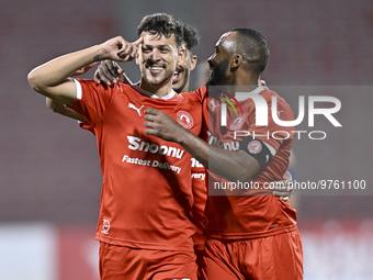 Youssef Msakni (L) of Al Arabi SC celebrate after scoring during the QNB Stars League match between Al Arabi SC and Al Sailiya SC at the Gra...