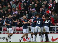 Luton Town's players celebrate their opening goal during the Sky Bet Championship match between Sunderland and Luton Town at the Stadium Of...