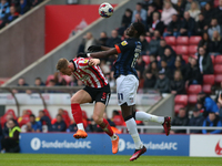 Luton Town's Elijah Adebayo wins a header against Sunderland's Daniel Ballard during the Sky Bet Championship match between Sunderland and L...