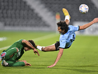 Mohamed Khlied Hassan (R) of Al Wakrah SC and Shojae Khalilzadeh (L) of Al Ahli SC battle for the ball during the QNB Stars League match bet...