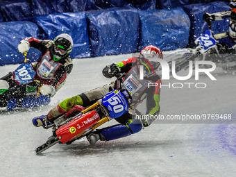 Harald Simon (50) (Red) leads Andrej Divis (107) (White) and Max Koivula (24) (Yellow) during the Ice Speedway Gladiators World Championship...