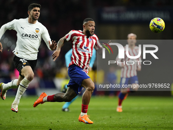 Memphis Depay centre-forward of Atletico de Madrid and Netherlands and Cenk Ozkacar centre-back of Valencia and Turkey compete for the ball...