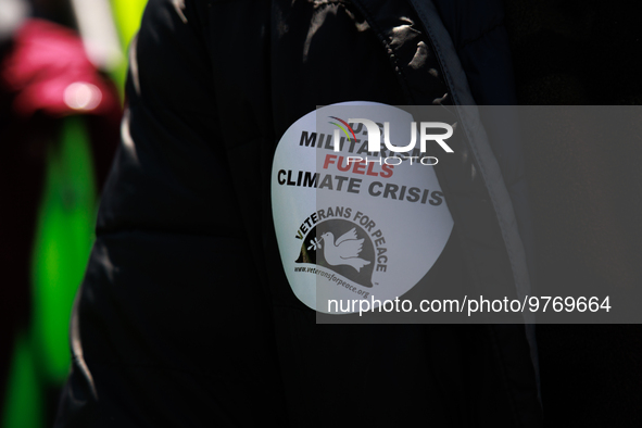 A demonstrator wears a sticker during an anti-war protest in Washington, D.C. on March 18, 2023. The protest, organized by the Answer Coalit...