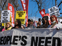 Demonstrators march in Washington, D.C. on March 18, 2023 during an anti-war protest organized by the Answer Coalition and dozens of other g...