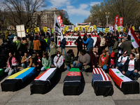 Demonstrators place symbolic body caskets on the ground in front of the White House during an anti-war protest in Washington, D.C. on March...
